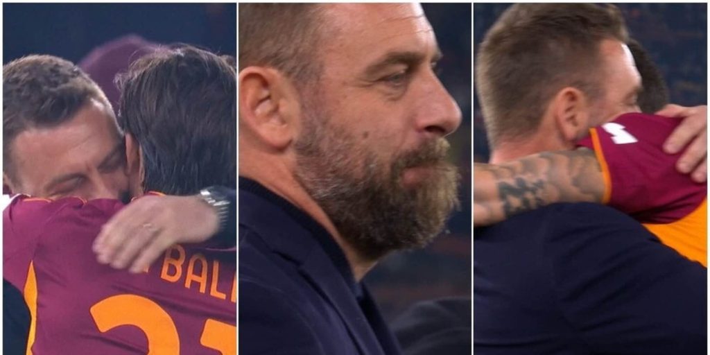 Întâlnirea emoționantă a lui De Rossi cu jucătorii de la Roma: abisuri de nostalgie la Olimpico Într-un moment emoționant înainte de meciul dintre Roma și Genoa, Gianluca Mancini și Paulo Dybala s-au îndreptat spre banca de rezerve pentru a-l îmbrățișa pe Daniele De Rossi