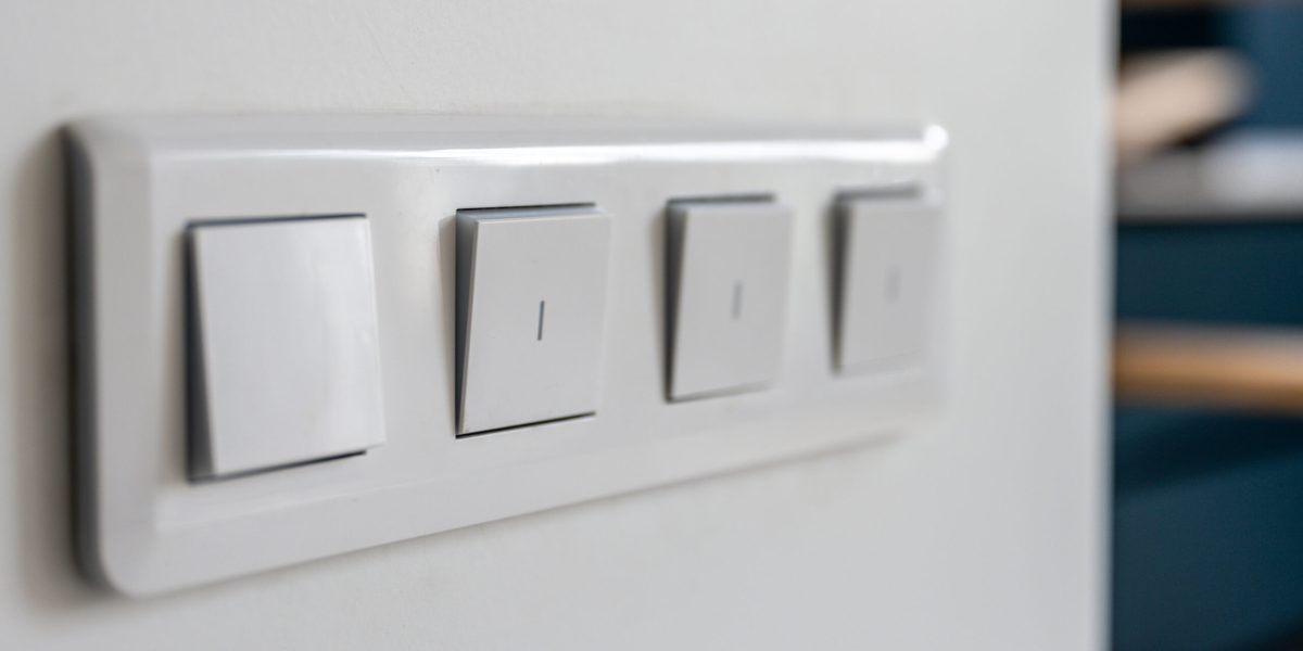 four-light-switches-macro-with-bokeh-background-minimal-design-scaled.jpg - StiriAlese