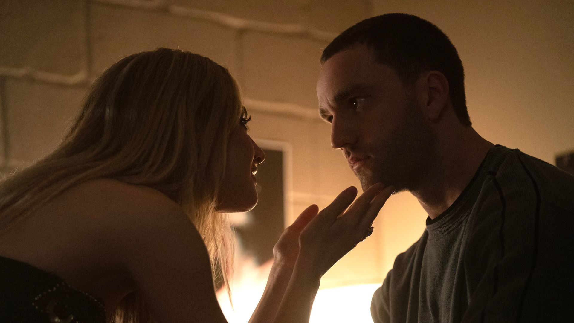 Lucy holds Stephen's chin in her hands in Tell Me Lies season 3