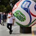 A fan snaps a photo alongside a giant soccer ball display outside the B.C. legislature in March. Nelson will host a FIFA event on June 24 at Lakeside Park. (Tony Trozzo/Victoria News)