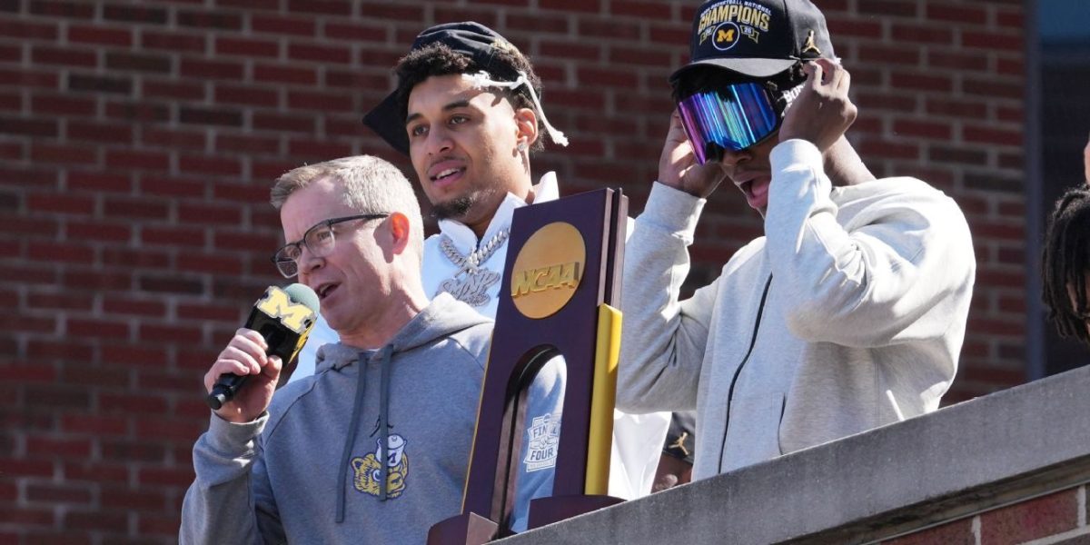 Michigan, May toast title with fans: 'This trophy is yours'