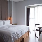 hotel-bedroom-with-double-bed-table-tv-set-scaled.jpg - StiriAlese