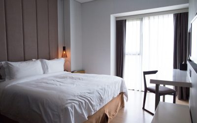 hotel-bedroom-with-double-bed-table-tv-set-scaled.jpg - StiriAlese